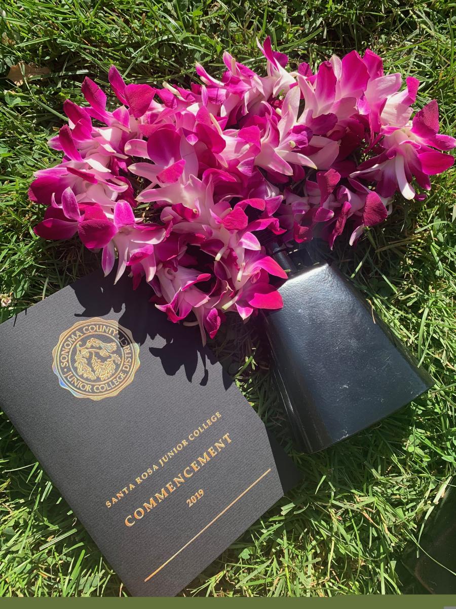 graduation program, orchid and cowbell